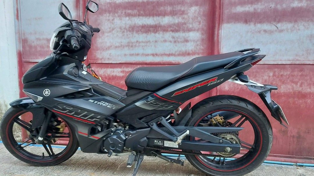 Yamaha Sniper 150 Matte Black (Category: Motorbikes for Sale) located in Bulacan. Submitted by allanroque1280 (Listing ID 1461298055, Image 2). Description: Yamaha Sniper 150 matte black. first owner complete legal papers w/ plate registered 32k odo all stock engine no issue 2 original keys 🔑 newly change oil new UMA racing pipe new battery N36 Novsight head bulb michelin tire P58,000 slightly nego. RFS upgrade 0933 221 8006.