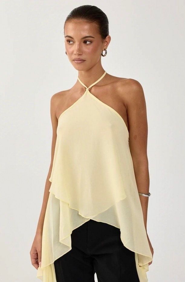 Yellow Chiffon Layered Halter Neck Top (Category: Sleeveless) located in Quezon City. Submitted by tacocat888 (Listing ID 1461277320, Image 1). Description: - Size S - Cute & dainty butter yellow summer top - High quality and light flowy fabric with adjustable ties - No flaws - Versatile piece: dress it up or down - Chic and elegant style - Ties at the back of the neck for an adjustable fit RFS: Decluttering 📍 QC Shipping fee will be shouldered 