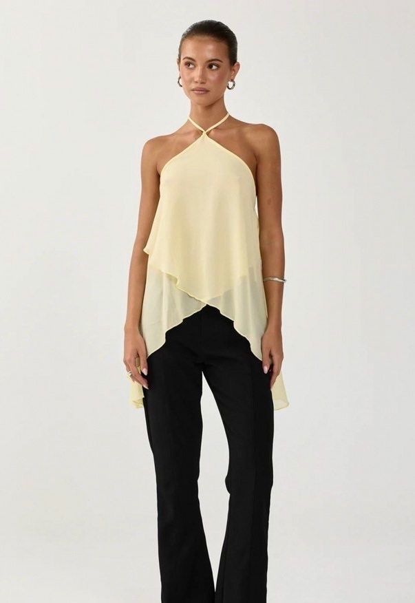 Yellow Chiffon Layered Halter Neck Top (Category: Sleeveless) located in Quezon City. Submitted by tacocat888 (Listing ID 1461277320, Image 2). Description: - Size S - Cute & dainty butter yellow summer top - High quality and light flowy fabric with adjustable ties - No flaws - Versatile piece: dress it up or down - Chic and elegant style - Ties at the back of the neck for an adjustable fit RFS: Decluttering 📍 QC Shipping fee will be shouldered 