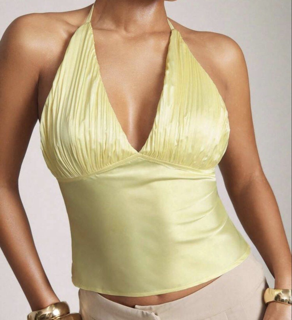 Yellow Ruched Halter Neck Top (Category: Sleeveless) located in Manila. Submitted by cooldragon_2d8241 (Listing ID 1461193617, Image 1). Description: - MEDIUM — fits upto LARGE Light yellow halter top - Ruched detailing on the bust - Fabric has a slight sheen - Cropped style - Ideal for high-waisted bottoms - Perfect for night outs or special occasions - Very flattering cut.