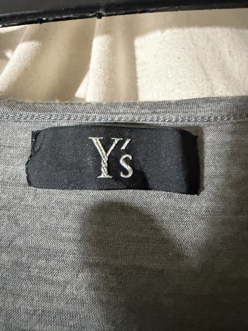Y's Long Sleeve Wool Blend Shirt Grey (Category: Longsleeves) located in Mandaluyong City. Submitted by jellyace777 (Listing ID 1461139855, Image 2). Description: - Brand: Y's - Material: 70% Wool, 30% Polyester - Condition: Small pinhole on shoulder area (please refer to the last photo) - Features: Great for layering - Stretchy fabric L - 30 W - 17 Sleeve Length - 29.