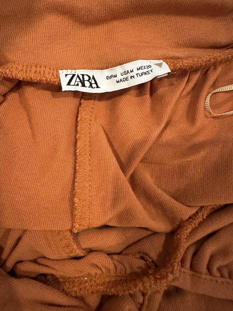 Zara Balloon Dress Muted Orange Halter Backless Adjustable Strap (Category: Dresses) located in Angeles City. Submitted by luxenstuff (Listing ID 1461229104, Image 3). Description: - Zara Balloon Dress - Size: Medium (M) Armpit to armpit can fir up to 30in - Color: Muted Orange - Neckline: Halter - Design: Backless - Features: Adjustable straps for a perfect fit - Length: 46 inches or longer - Origin: Made in Turkey 10/10 kept unused.