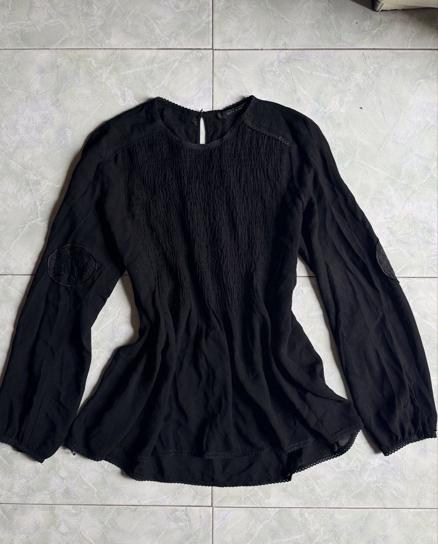 Zara Basic Black Long Sleeve Smocked Blouse (Category: Blouses) located in General Santos City (Dadiangas). Submitted by ssssshhhhhhhhh (Listing ID 1460949849, Image 1). Description: - Zara Basic black long sleeve blouse - Smocking detail on the front - Lace trim along neckline and hem - Button closure at the back of the neck - Lightweight fabric - Made in Morocco.