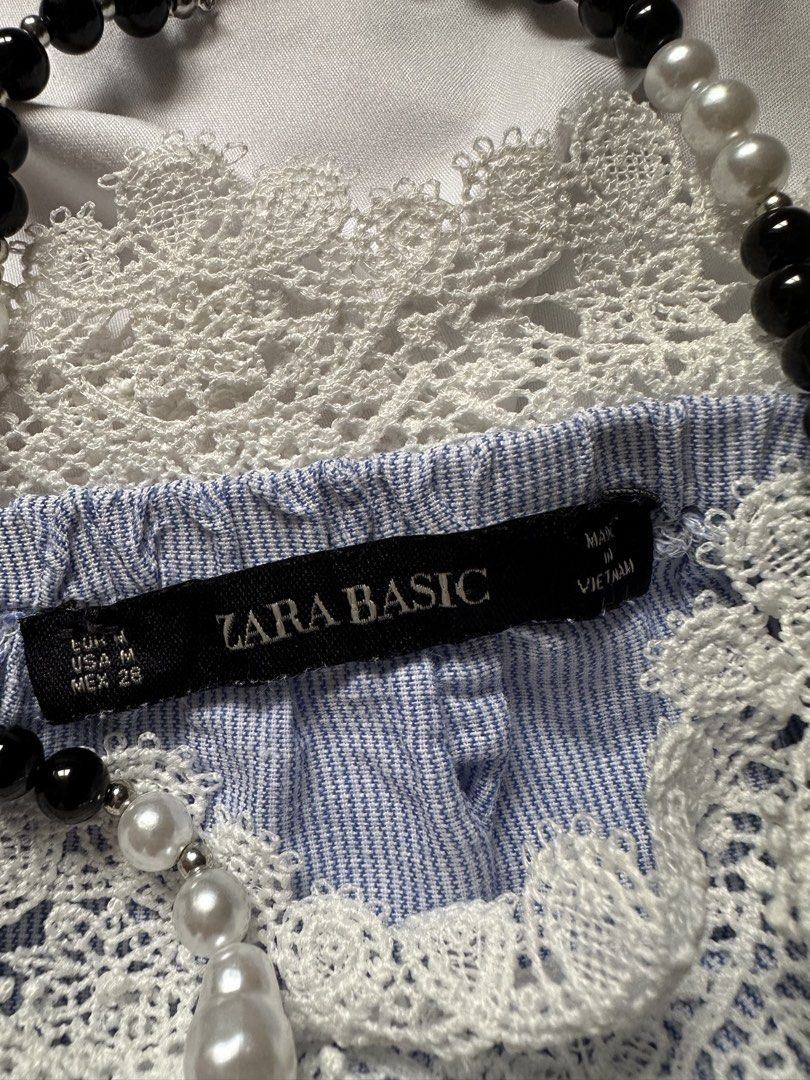Zara Basic Blue Striped Off-Shoulder Top with Lace Trim (Category: Blouses) located in Bacoor. Submitted by ura_ph2026 (Listing ID 1461317851, Image 3). Description: Zara Basic blue and white striped off-the-shoulder top with white lace trim and bell sleeves. Size M. Perfect for casual outings..