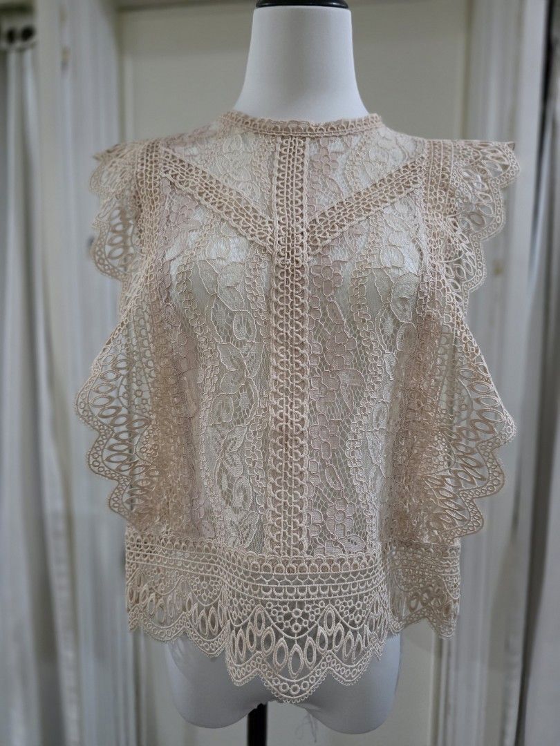 Zara Lace Top - Size M (Category: Sleeveless) located in Quezon City. Submitted by sec0nd.st0ry (Listing ID 1461226683, Image 1). Description: - Zara lace top - Color: Light pinkish-beige - Size: Medium - Features intricate lace detailing all over - High neckline with scalloped edges - Versatile: perfect for layering or wearing on its own - Ideal for night outs or special occasions.
