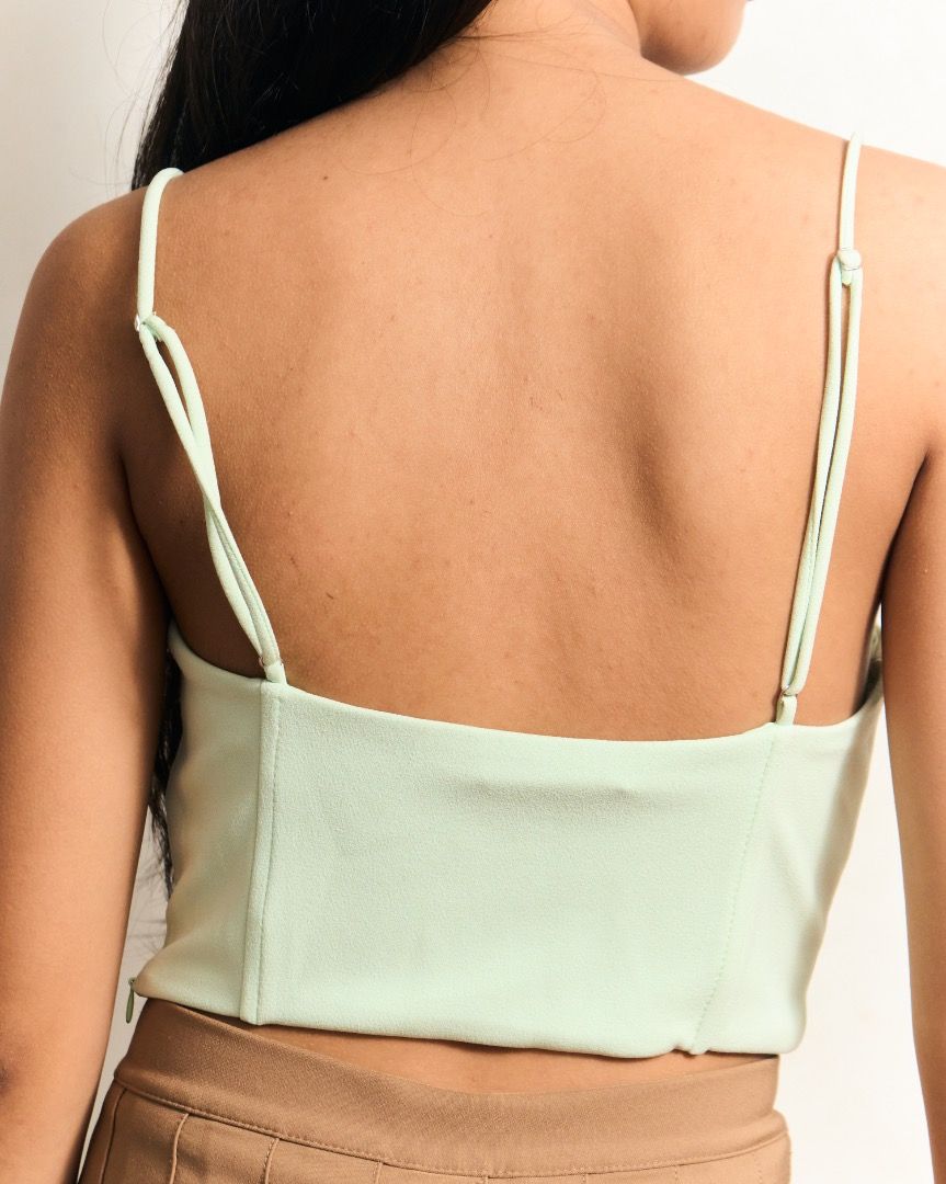 ZARA Light Green Corset Top (Category: Others Tops) located in Manila. Submitted by missalmon (Listing ID 1461256465, Image 2). Description: L: 7.5 inches W: 13.5 inches Adjustable Spaghetti Strap Zipper on side Issue on strap (See pic).