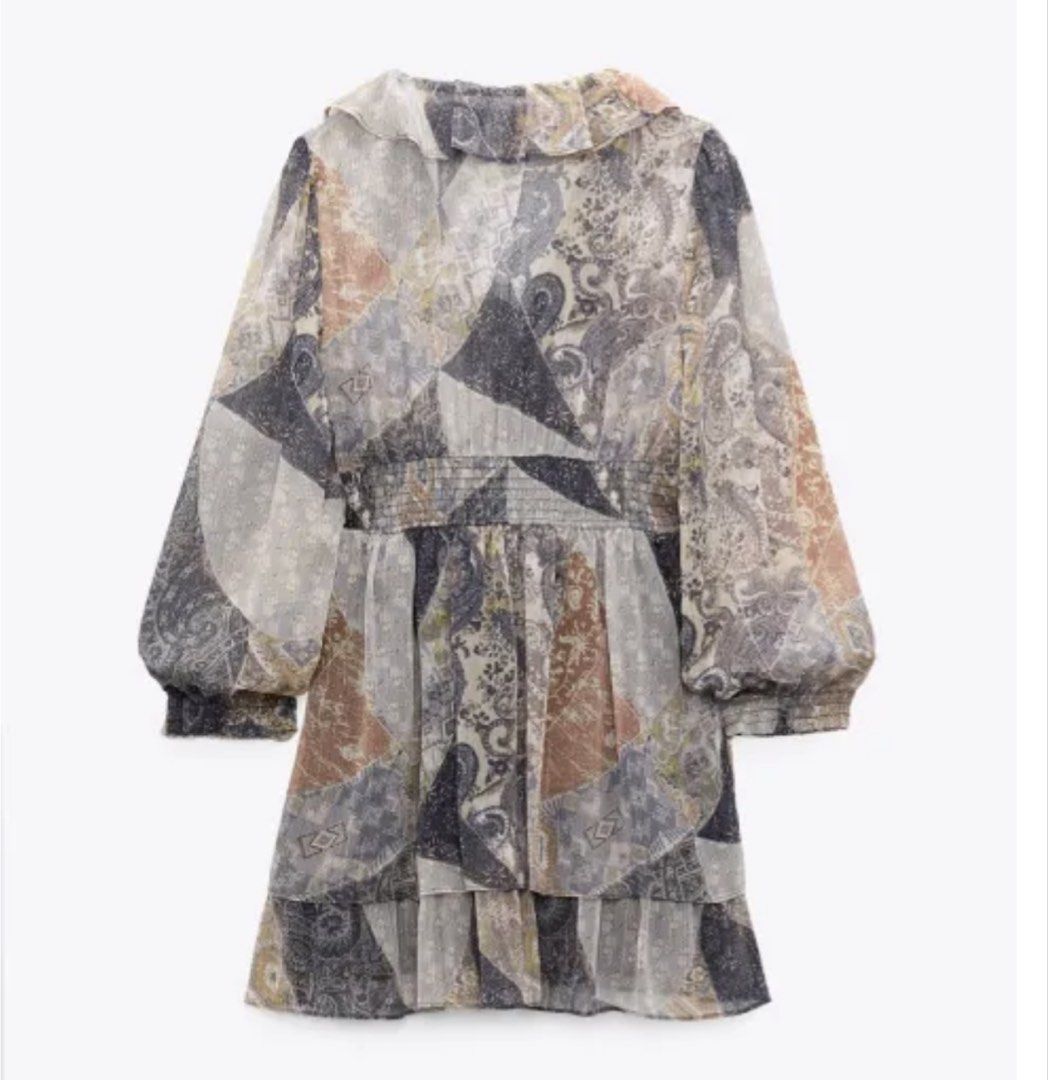 ZARA Patchwork Print Ruffle Dress (Category: Dresses) located in Taguig. Submitted by PF910 (Listing ID 1461311178, Image 3). Description: - Zara dress with a unique patchwork print - Features a romantic ruffled neckline - Stylish long balloon sleeves - Flattering smocked waist for a defined silhouette - Elegant tiered hemline - Made from sheer fabric with a subtle shimmer - Ideal for a night out or a special occasion.