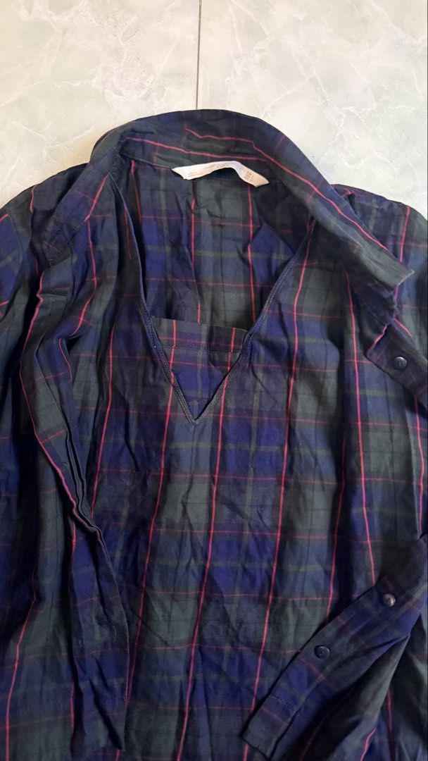 ZARA Plaid Long Sleeve Shirt (Category: Tshirts & Polo Shirts ) located in General Santos City (Dadiangas). Submitted by ssssshhhhhhhhh (Listing ID 1461302939, Image 3). Description: - Brand: ZARA - Color: Dark blue and green plaid - Neckline: V-neck - Closure: Button-up front - Sleeves: Long sleeves with button cuffs - Fit: Relaxed fit - Occasion: Casual wear - Size: Check label for details.