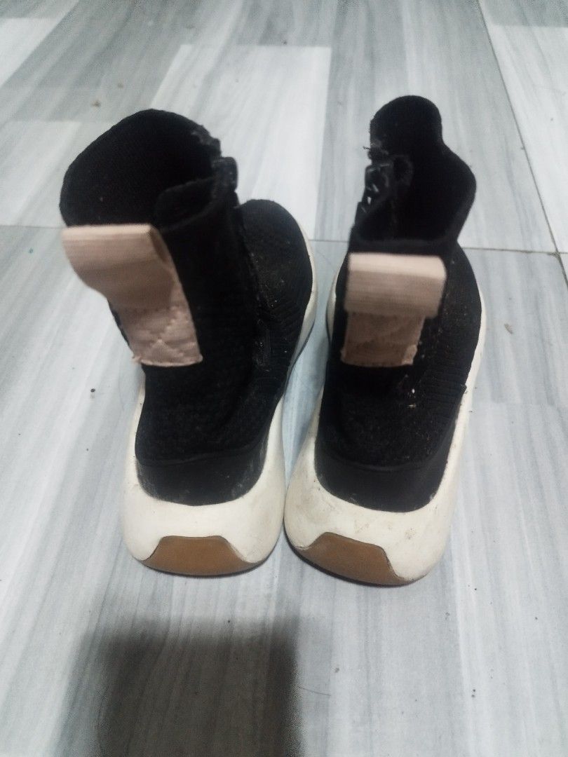 Zara shoes for kids (Category: Babies & Kids Fashion) located in Manila. Submitted by Mayo.T (Listing ID 1461320147, Image 1). Description: - Black sock-style sneakers - Side zipper closure - White rubber soles with brown heel accent - Minor scuffing on soles and fabric - Perfect for everyday wear - needs cleaning .