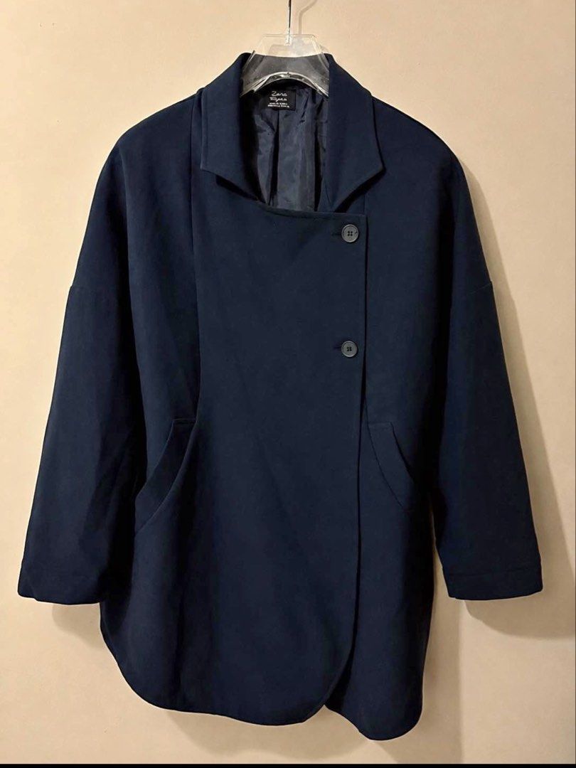 Zara Trafaluc Navy Blue Asymmetrical Button Jacket Size S (Category: Coats, Jackets and Outerwear) located in Las Pinas. Submitted by mari.santos. (Listing ID 1461293452, Image 1). Description: - Zara navy blue jacket - Asymmetrical front button closure - Two button details - Functional pockets - Versatile for layering, wear open or closed - Made in Turkey.