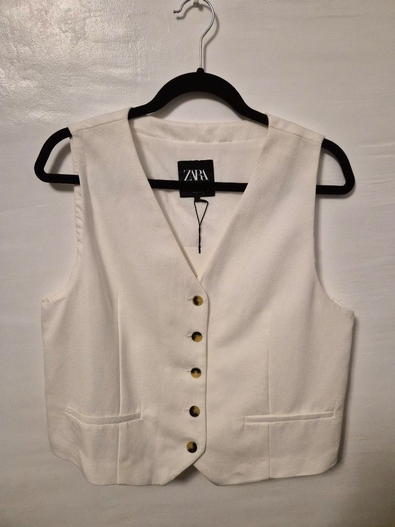 ZARA White Vest Button-Up Size XL (Category: Sleeveless) located in Pasig City. Submitted by thethingswekeep (Listing ID 1461171479, Image 1). Description: ZARA - White vest, Brand new still with tag. RFS - too big for me. .