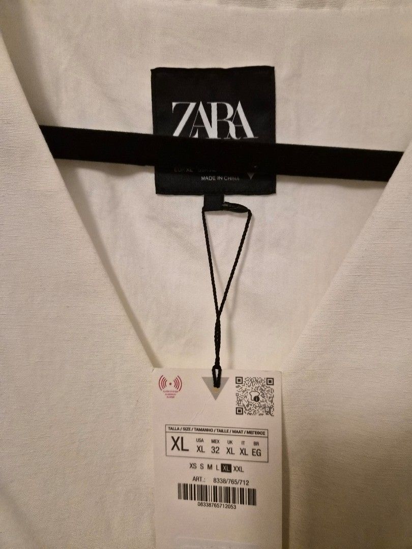 ZARA White Vest Button-Up Size XL (Category: Sleeveless) located in Pasig City. Submitted by thethingswekeep (Listing ID 1461171479, Image 3). Description: ZARA - White vest, Brand new still with tag. RFS - too big for me. .
