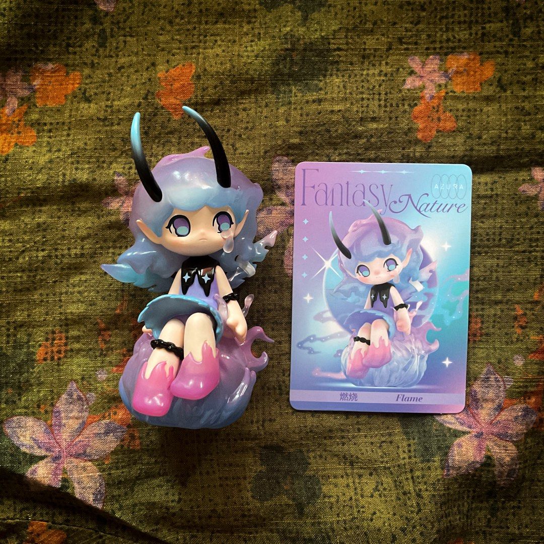 ZSIGA & AZURA Blind Box Figures (Category: Designer & Blind Box Toys) located in Manila. Submitted by zencat_a88b04 (Listing ID 1461146560, Image 2). Description: - ZSIGA character with dog blind box figure - AZURA 'Flame' character from Fantasy Nature blind box figure - Both figures come with their original character cards - Ideal for collectors of blind box toys.