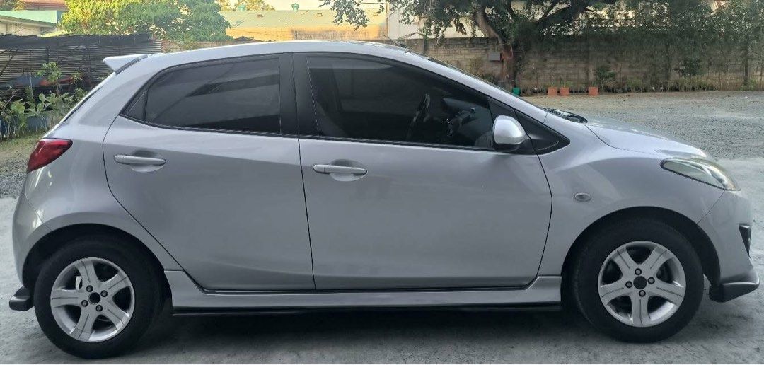 Mazda 2 1.3 Hatchback Manual (Category: Used Cars) located in Manila. Submitted by tekz27 (Listing ID 1461341147, Image 2). Description: first owner[lady owned] insured running good conditions yearly pms updated legal documents all genuine stock parts minor dents its normal because ur buying is a 2nd hand. negotiable upon viewing contact me here if u are interested for faster transaction. .