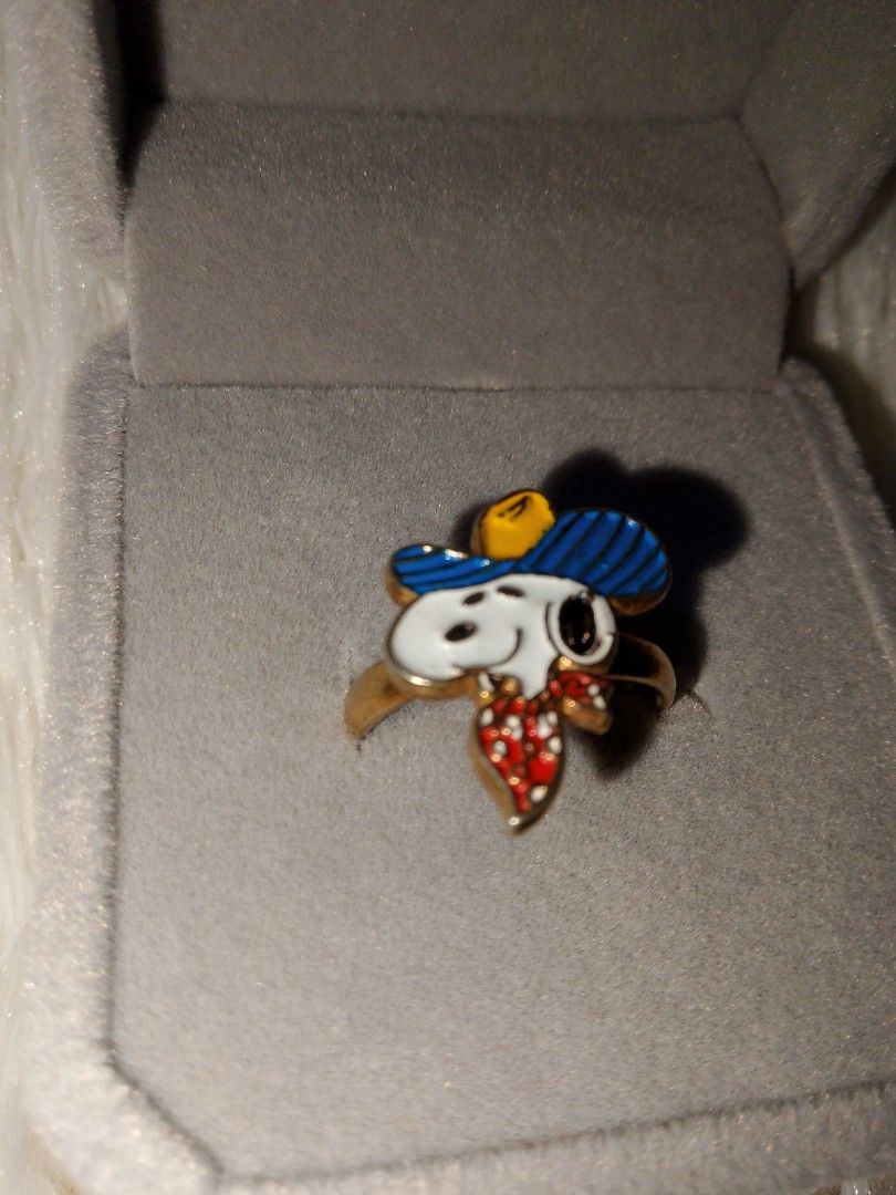 1970s aviva snoopy cowboy ring (Category: Vintage Collectibles) located in Manila. Submitted by jym008 (Listing ID 1461339196, Image 1). Description: Vintage 1970s Aviva Snoopy Cowboy Ring 🤠 Original enamel, no crack / no chip Adjustable size, gold-tone Ring only + box Origin: Japan (Aviva USA 70s) ₱900 - GCash / J&T / Lalamove PM lang!.