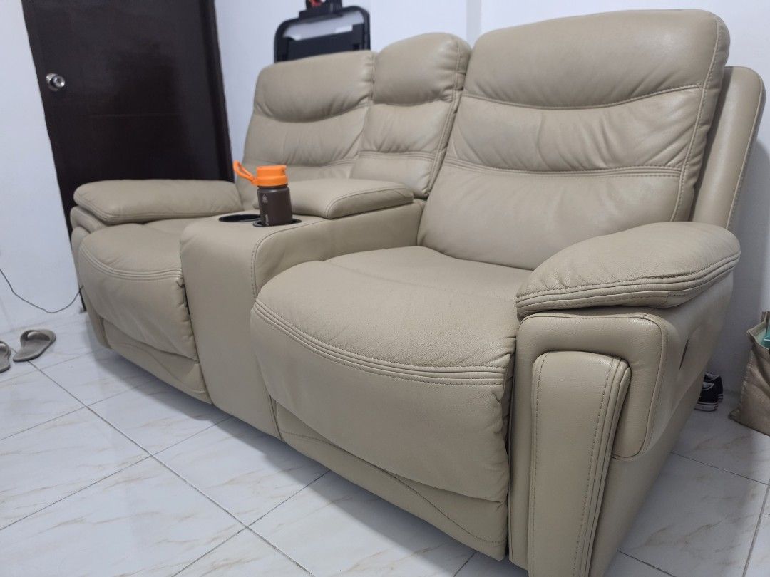 2-Seater Leather Recliner Sofa with Cup Holders (Category: Sofas) located in Manila. Submitted by fiercecat_824333 (Listing ID 1461342265, Image 2). Description: Lazy Boy 2 seater recliner seat. German Leather. For only 23k, if kunin agad, may bawas pa. We can shoulder the delivery fee if malapit lang within metro manila. Location: Pateros 1 year old palang itong sofa samin. Sobrang ganda ng leather nyan. Nabili namin 'to ng 50k brand new price. 