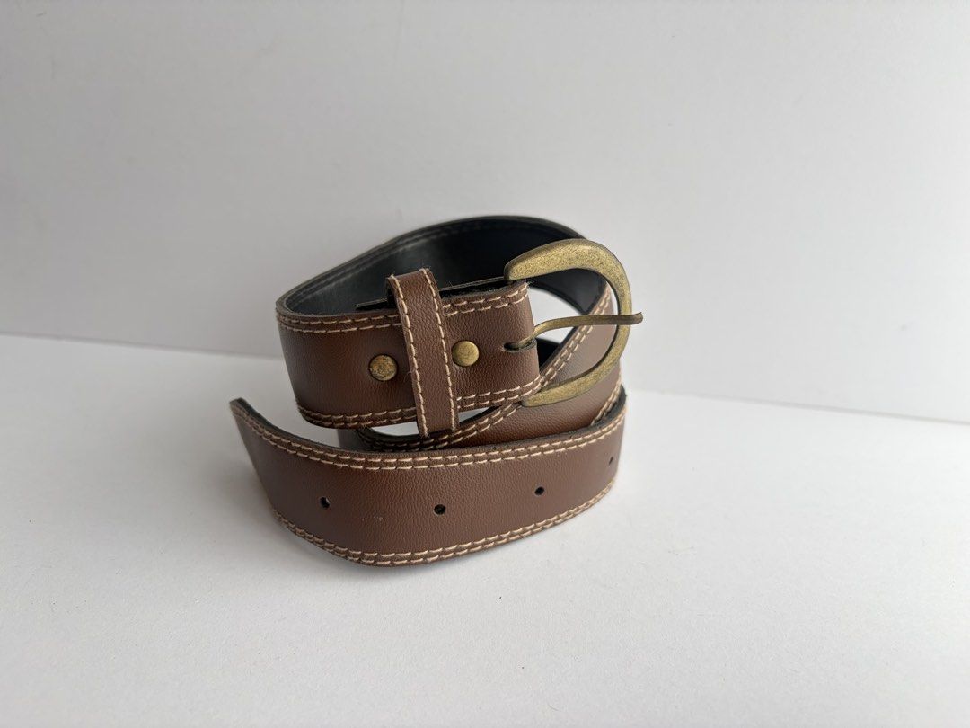 9. Brown Leather Belt 49 (Category: Belts) located in Quezon City. Submitted by wagwagan_ukay_blues (Listing ID 1461468733, Image 2). Description: From Japan In good condition ❗️please expect signs of usage Hole size - 21” -26” Width -.7” Overall - 28”.