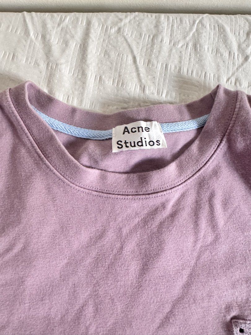 Acne Studios Face Logo Lavender Sweatshirt Dress (Category: Dresses) located in Las Pinas. Submitted by preiscloset (Listing ID 1461405667, Image 3). Description: - Acne Studios lavender dress - Features iconic embroidered face logo on chest - Short sleeves and crew neck - Made from comfortable sweatshirt material - Ideal for casual everyday wear.