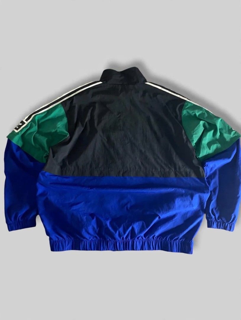 Adidas Colorblock Track Jacket (Category: Coats, Jackets and Outerwear) located in Bansalan. Submitted by thriftyzzz (Listing ID 1461473568, Image 2). Description: - Classic Adidas colorblock jacket - Features iconic three stripes on sleeves - Full zip front closure - Comfortable lining for all-day wear - Perfect for casual outings or sports activities - Size XL - Note: Small mark on the blue panel, please refer to the last photo for details..