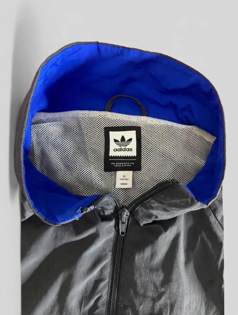 Adidas Colorblock Track Jacket (Category: Coats, Jackets and Outerwear) located in Bansalan. Submitted by thriftyzzz (Listing ID 1461473568, Image 3). Description: - Classic Adidas colorblock jacket - Features iconic three stripes on sleeves - Full zip front closure - Comfortable lining for all-day wear - Perfect for casual outings or sports activities - Size XL - Note: Small mark on the blue panel, please refer to the last photo for details..