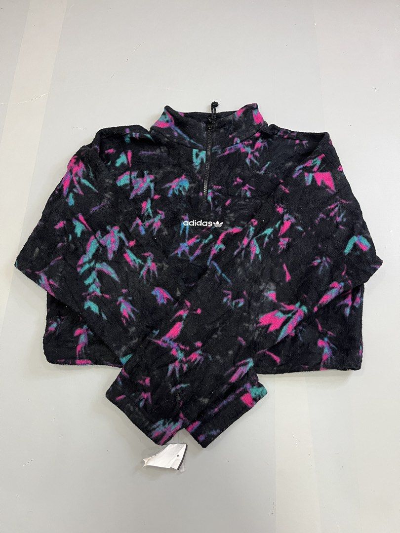 Adidas Fleece Pullover Jacket Multi-Color Print (Category: Coats, Jackets and Outerwear) located in Mabalacat. Submitted by aas_thriftfings (Listing ID 1461492915, Image 1). Description: - Cool Adidas fleece pullover - Black base with vibrant pink and teal abstract print - Quarter zip neckline - Cropped fit - 100% polyester material - Perfect for layering or as a standalone piece - Check tags for sizing details.