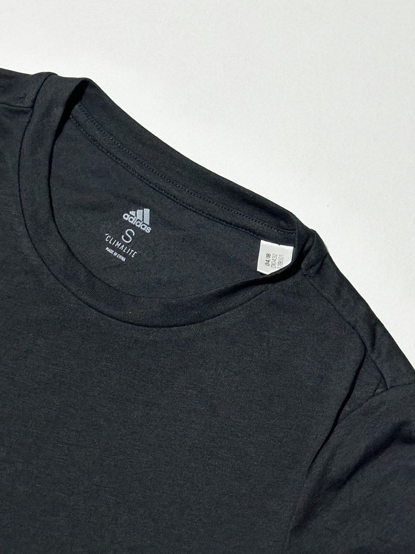 Adidas Performance T-Shirt (Category: Activewear) located in Manila. Submitted by reclaimed.shop (Listing ID 1461360595, Image 3). Description: Description: Designed for training and active lifestyles, this adidas women’s performance tee combines a fitted athletic silhouette with a bold, eye-catching graphic. Featuring a jet black matte finish and an oversized adidas graphic with a dynamic marble-inspired pattern, it offers a sporty look while ke