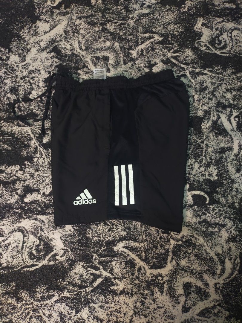 Adidas running short🏃 (Category: Shorts) located in Cagayan de Oro. Submitted by jaypeedeistilo (Listing ID 1461464589, Image 2). Description: size large on tag✅ still in a good condition✅ waist: 26-36✅ length: 16 idk kung issue po sya nasa last 2 pictures po, may mga makintab na part.