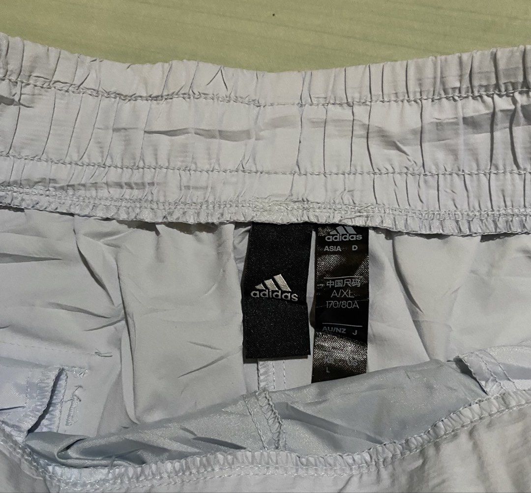 Adidas Shorts with Belt (Category: Shorts) located in San Carlos City. Submitted by roseee_012 (Listing ID 1461467991, Image 3). Description: - Light purple Adidas shorts - Size: L - Elastic waistband with adjustable black belt - Zipper pocket on the left side - Back pocket on the right side - Ideal for sports or casual wear.