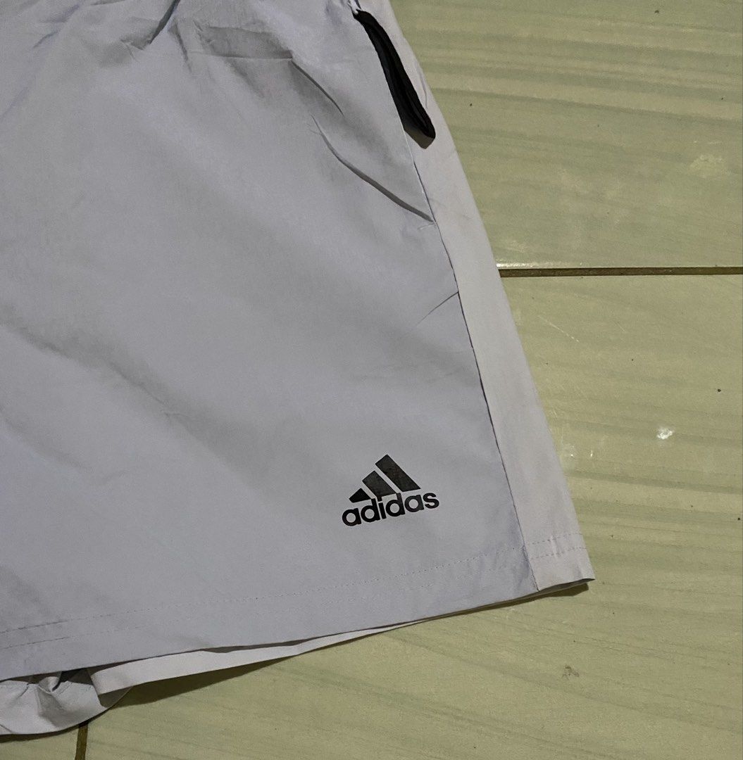 Adidas Shorts with Belt (Category: Shorts) located in San Carlos City. Submitted by roseee_012 (Listing ID 1461467991, Image 2). Description: - Light purple Adidas shorts - Size: L - Elastic waistband with adjustable black belt - Zipper pocket on the left side - Back pocket on the right side - Ideal for sports or casual wear.