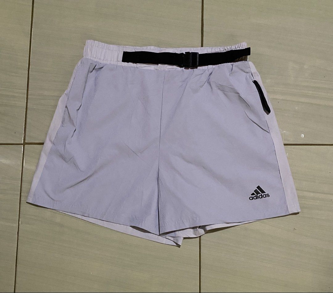 Adidas Shorts with Belt (Category: Shorts) located in San Carlos City. Submitted by roseee_012 (Listing ID 1461467991, Image 1). Description: - Light purple Adidas shorts - Size: L - Elastic waistband with adjustable black belt - Zipper pocket on the left side - Back pocket on the right side - Ideal for sports or casual wear.