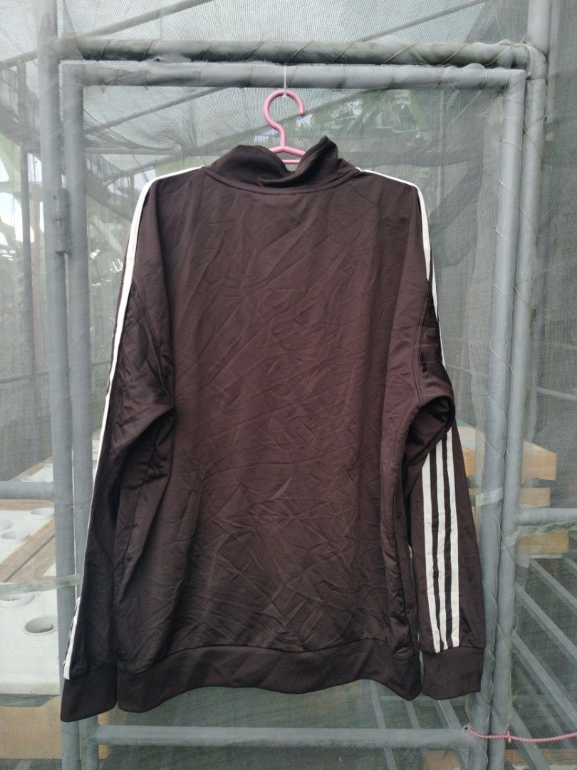 Adidas Track Jacket (Category: Coats, Jackets and Outerwear) located in Legazpi City. Submitted by genobecollectives (Listing ID 1461422076, Image 3). Description: Adidas track jacket 800 + sf - White stripes on sleeves - Full zip closure - Two zippered front pockets - Iconic Adidas logo on chest - Ideal for casual wear or athletic activities -excellent condition -23 x 28.