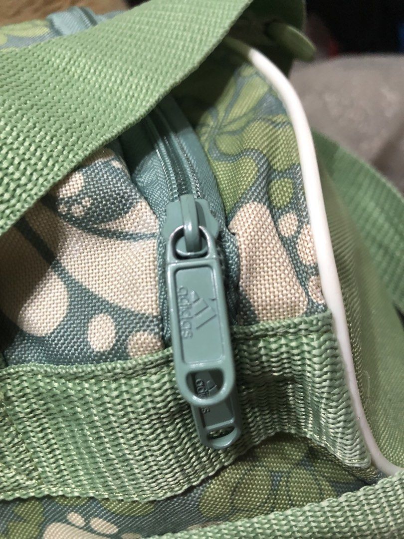 Adidas Vintage Duffel Bag (Category: Other Sports Equipment and Supplies) located in Quezon City. Submitted by bettymeir07 (Listing ID 1461538032, Image 3). Description: Vintage Adidas green and white floral athletic duffel bag featuring a distinct all-over retro flower pattern and a large tonal green Adidas logo on the front. -In good condition -PRICE NEGOTIABLE MOP: GOTYME or GCASH.