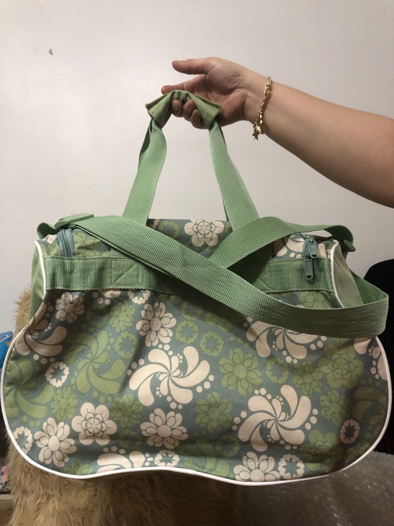 Adidas Vintage Duffel Bag (Category: Other Sports Equipment and Supplies) located in Quezon City. Submitted by bettymeir07 (Listing ID 1461538032, Image 2). Description: Vintage Adidas green and white floral athletic duffel bag featuring a distinct all-over retro flower pattern and a large tonal green Adidas logo on the front. -In good condition -PRICE NEGOTIABLE MOP: GOTYME or GCASH.