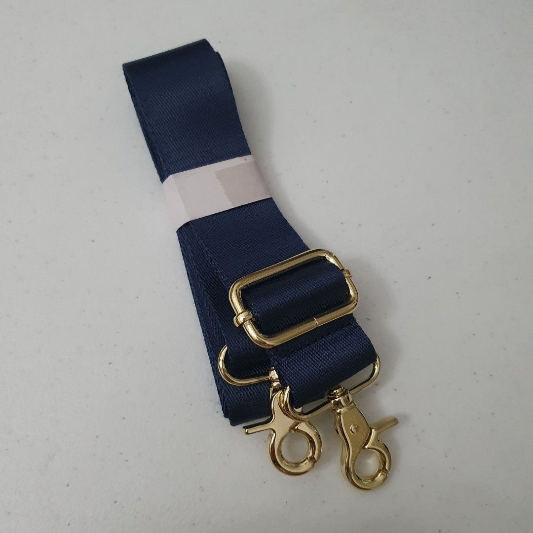 Adjustable Navy Blue Bag Strap with Gold Hardware (Category: Sling Bags) located in Paranaque City. Submitted by cobien (Listing ID 1461418534, Image 1). Description: - Navy blue adjustable bag strap - Features shiny gold hardware with secure swivel clasps - Made from durable, strong nylon material - Ideal for replacing worn-out straps or customizing your bag.