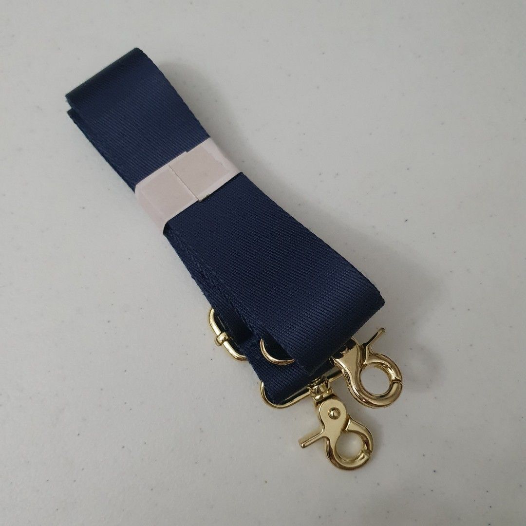 Adjustable Navy Blue Bag Strap with Gold Hardware (Category: Sling Bags) located in Paranaque City. Submitted by cobien (Listing ID 1461418534, Image 2). Description: - Navy blue adjustable bag strap - Features shiny gold hardware with secure swivel clasps - Made from durable, strong nylon material - Ideal for replacing worn-out straps or customizing your bag.