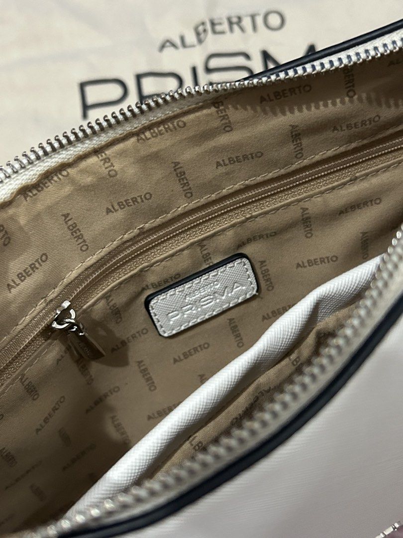 ALBERTO PRISMA Raylan Shoulder Bag (white) (Category: Shoulder Bags) located in Roxas City. Submitted by faithlyaen (Listing ID 1461456259, Image 2). Description: - white ALBERTO PRISMA shoulder bag - includes matching mini pouch - with minimal stains (dm for pictures) - price is negotiable .