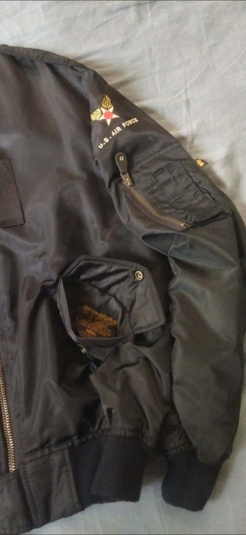 Alpha Industries U.S. Air Force MA-1 Bomber Jacket (Category: Coats, Jackets and Outerwear) located in Caloocan City. Submitted by onethriftjel (Listing ID 1461371847, Image 3). Description: - Classic black U.S. Air Force bomber jacket - Features iconic U.S. Air Force patches on chest and sleeve - Zippered sleeve pocket with pen slots - Inner lining visible in photos - Ideal for everyday wear.