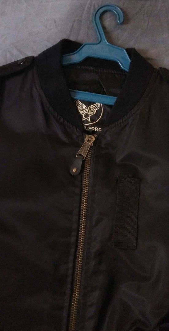 Alpha Industries U.S. Air Force MA-1 Bomber Jacket (Category: Coats, Jackets and Outerwear) located in Caloocan City. Submitted by onethriftjel (Listing ID 1461371847, Image 2). Description: - Classic black U.S. Air Force bomber jacket - Features iconic U.S. Air Force patches on chest and sleeve - Zippered sleeve pocket with pen slots - Inner lining visible in photos - Ideal for everyday wear.