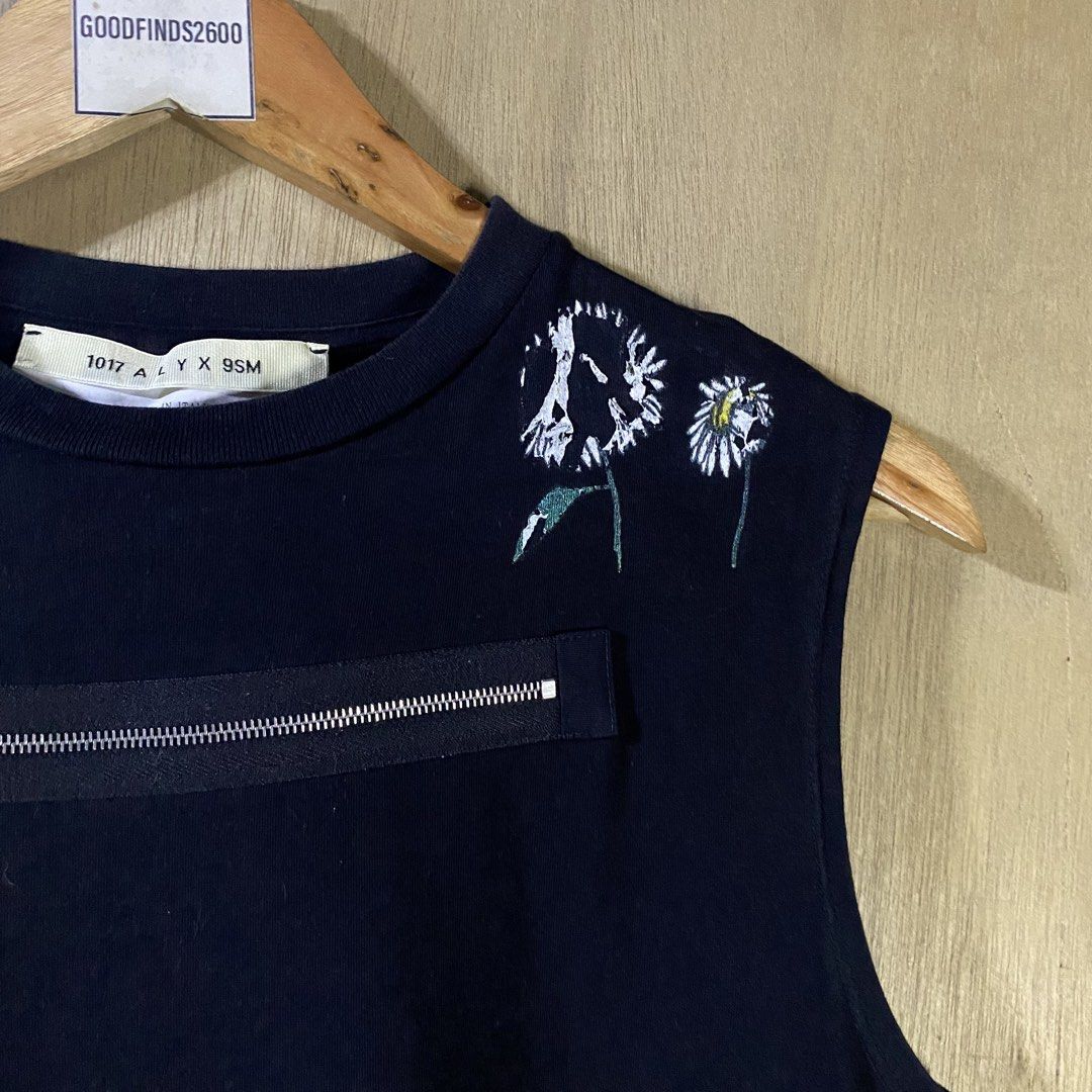 Alyx Daisy Zipper Tanktop (Category: Luxury Apparel) located in Baguio. Submitted by goodfinds2600v2 (Listing ID 1461493700, Image 3). Description: Size on tag: S fits S-M Dimensions: L-26 W/Bust-18.5 Description: unisex, 8.5-9/10 color rate Condition: Very good Issue/s: melted and peeled print .