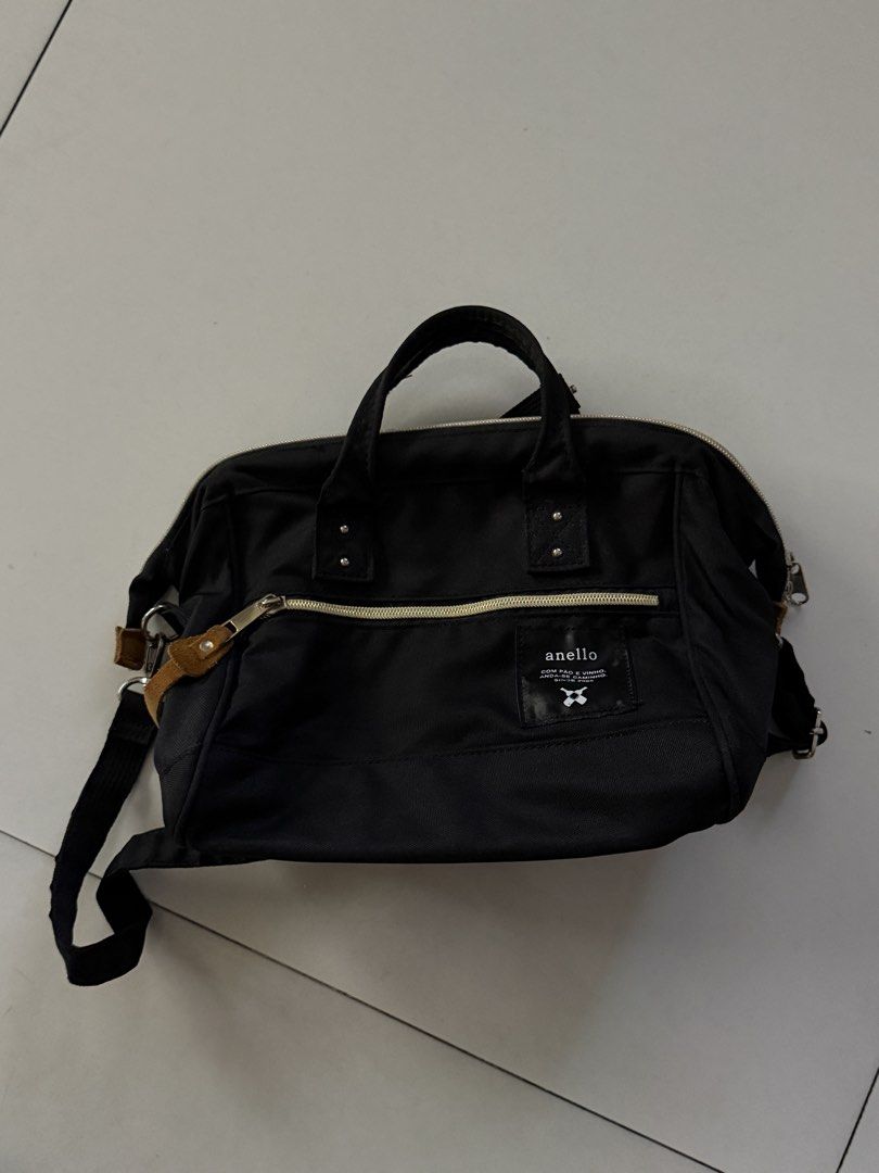 Anello 2-way Bag Black (Category: Cross-body Bags) located in Manila. Submitted by hatdognablue (Listing ID 1461360880, Image 1). Description: - Anello bag in classic black - Versatile: can be used as a handbag or shoulder bag - Features a convenient front zip pocket - Includes internal compartments for organization - Zippers are smooth and functional - Minor signs of wear on leather zipper pulls - Interior is clean and well-maintained.