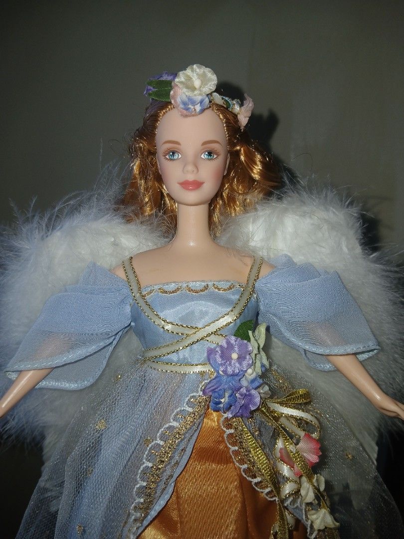Angel Doll with Harp and Wings (Category: Figurines & Statues) located in Subic. Submitted by frncnjntmr22 (Listing ID 1461332552, Image 3). Description: - Beautiful angel doll - Blonde hair - Blue and gold dress with lace overlay - White feathery wings - Comes with a small golden harp accessory - Ideal for collectors or as a decorative piece.