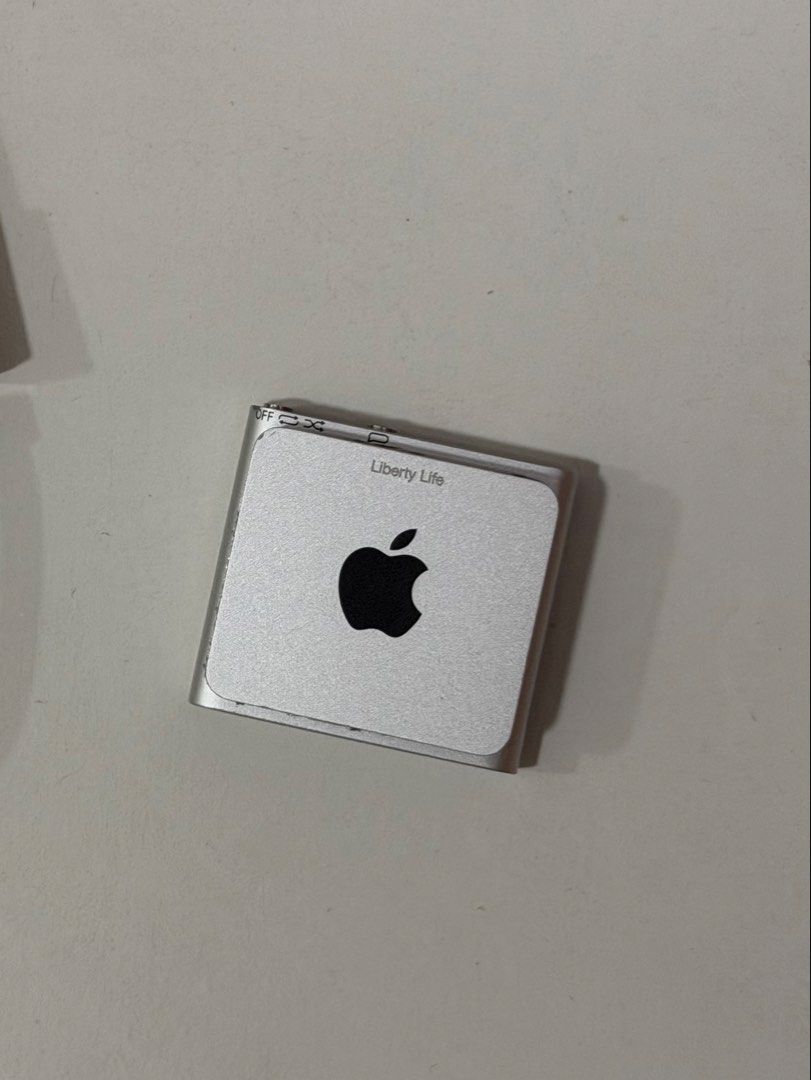 Apple iPod Shuffle 2gb silver (Category: Portable Music Players) located in Mandaluyong City. Submitted by bigjsdeclutter (Listing ID 1423604608, Image 2). Description: With New battery In really good condition Buyer to pickup from location or book for grab/lalamove as i can’t do meetups currently Mop: gcash or gotyme - Includes USB cable - Silver finish - Click wheel navigation - 3.5mm headphone jack - Apple logo visible - In good working condit
