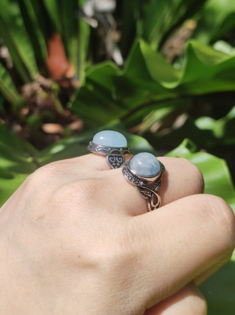 Aquamarine vintage ring setting (Category: Jewelry) located in Kinoguitan. Submitted by artemiscrystal (Listing ID 1461391418, Image 3). Description: - Two beautiful aquamarine rings. - Silver Plated setting - Adjustable size - Left ring: Larger oval-cut aquamarine with intricate scrollwork vintage setting. - Right ring: Round-cut aquamarine vintage setting. - Unique design - Great for stacking or wearing separately. - for men and women.
