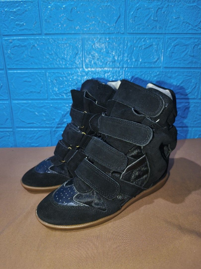 Archival Isabel Marant Wedge Sneakers (Category: Sneakers) located in Davao. Submitted by vndrgd (Listing ID 1461561144, Image 3). Description: - Stylish black suede wedge sneakers - Multiple velcro straps for a secure and adjustable fit - Wedge heel for added height and a fashionable silhouette - Comfortable for all-day wear - Perfect for adding an edgy touch to any outfit.