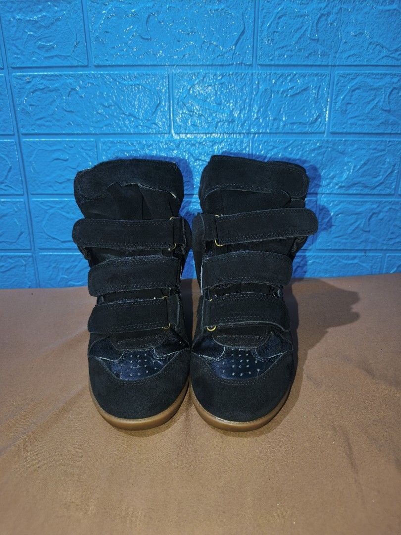 Archival Isabel Marant Wedge Sneakers (Category: Sneakers) located in Davao. Submitted by vndrgd (Listing ID 1461561144, Image 2). Description: - Stylish black suede wedge sneakers - Multiple velcro straps for a secure and adjustable fit - Wedge heel for added height and a fashionable silhouette - Comfortable for all-day wear - Perfect for adding an edgy touch to any outfit.