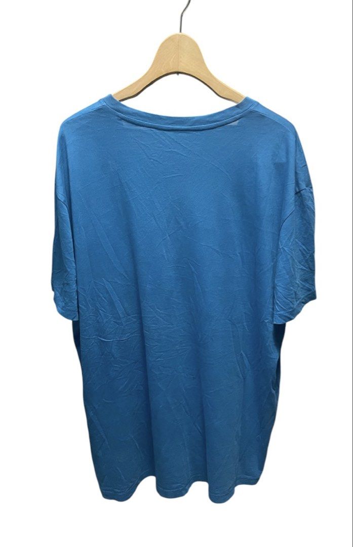 Armani Exchange Blue V-Neck Shirt (Category: Tshirts & Polo Shirts ) located in San Pedro. Submitted by lifebeginsaftercoff33 (Listing ID 1461478918, Image 3). Description: - Brand: Armani Exchange - Color: Blue - Neckline: V-neck - Material: 100% Pima Cotton - Size: XL - Dimes: 24 x 30 in - Style: Casual wear - Features: Soft and comfortable stretchy fabric - Condition: Please check photos for details - Made in Peru - RN#103723.