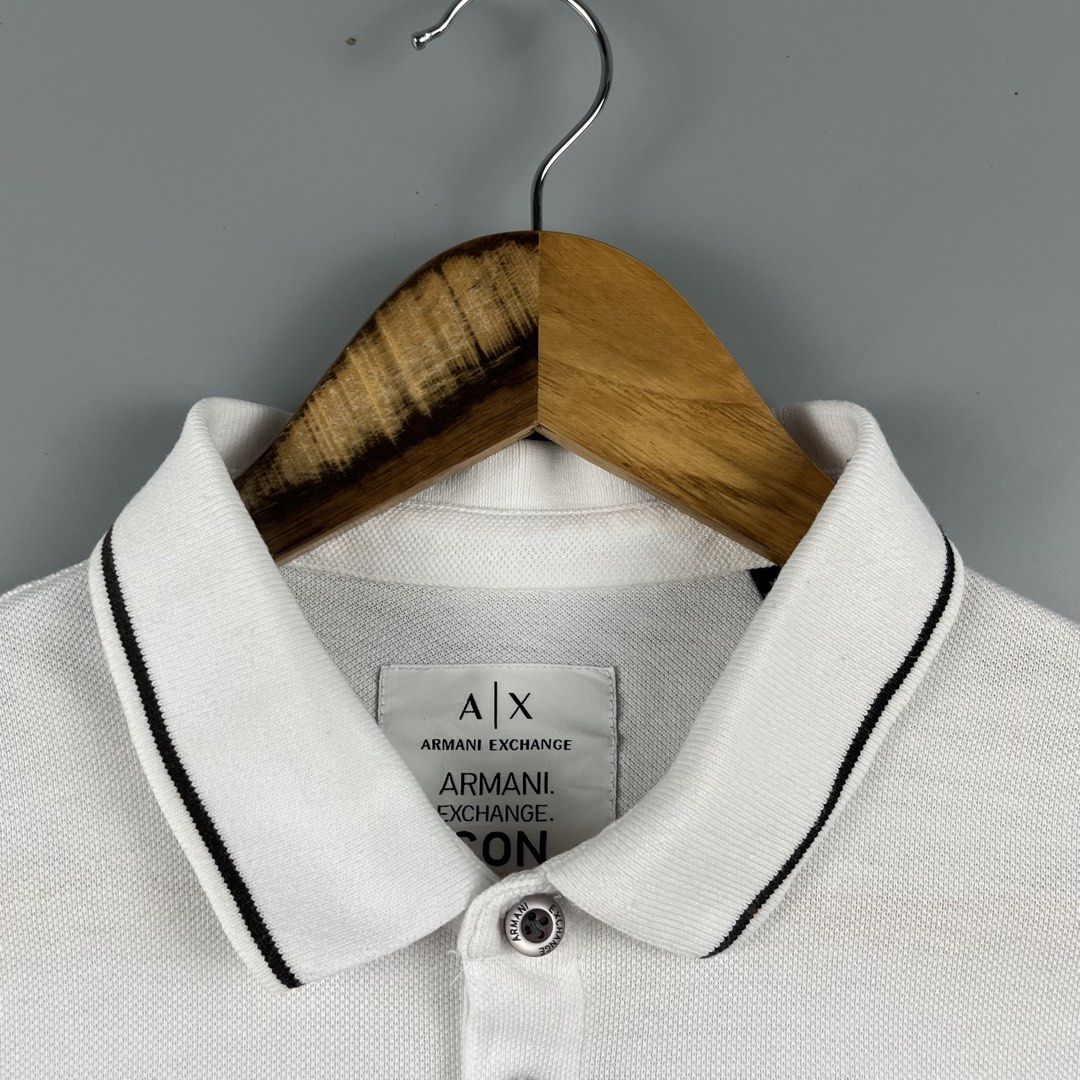 Armani Exchange White Polo (Category: Activewear) located in Los Banos. Submitted by 4030.archives. (Listing ID 1461516964, Image 3). Description: Armani Exchange White Polo 1200 Pesos Large Length : 27.5 inches Width : 22 inches Excellent Condition.