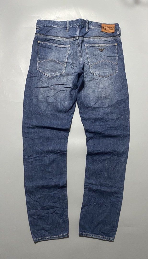 Armani Jeans AJ Denim Blue Jeans (Category: Jeans) located in Manila. Submitted by delunakenn94368 (Listing ID 1461536781, Image 2). Description: - Classic blue denim jeans from Armani Jeans - Features iconic AJ logo on back pocket - Leather patch at the waist - Button fly closure - Ideal for everyday wear - A wardrobe staple.