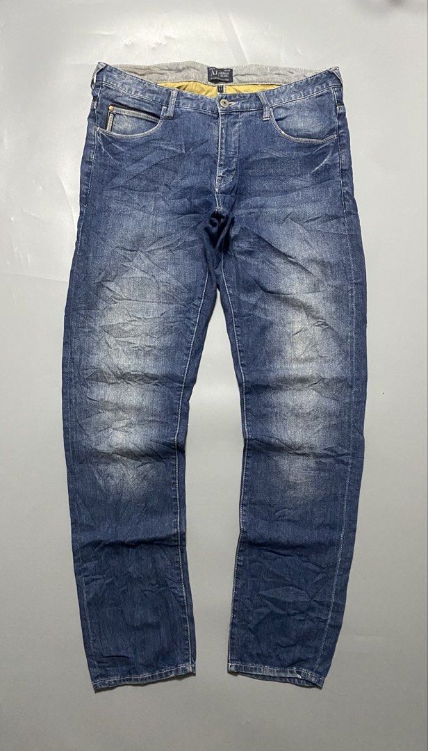 Armani Jeans AJ Denim Blue Jeans (Category: Jeans) located in Manila. Submitted by delunakenn94368 (Listing ID 1461536781, Image 3). Description: - Classic blue denim jeans from Armani Jeans - Features iconic AJ logo on back pocket - Leather patch at the waist - Button fly closure - Ideal for everyday wear - A wardrobe staple.
