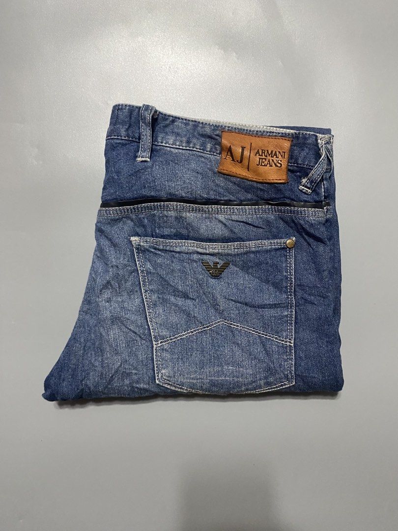 Armani Jeans AJ Denim Blue Jeans (Category: Jeans) located in Manila. Submitted by delunakenn94368 (Listing ID 1461536781, Image 1). Description: - Classic blue denim jeans from Armani Jeans - Features iconic AJ logo on back pocket - Leather patch at the waist - Button fly closure - Ideal for everyday wear - A wardrobe staple.